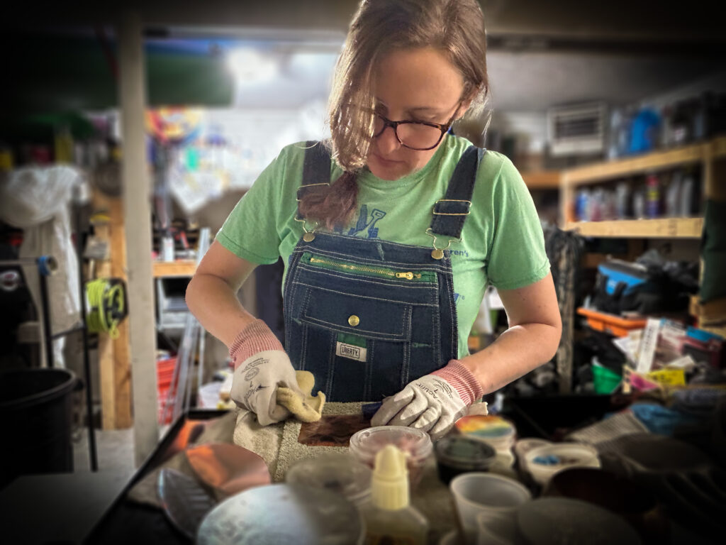 Megan working on copper piece